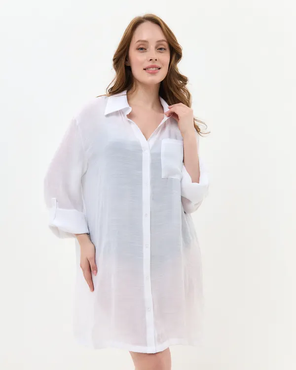 Woman wearing the white Red Peony beach cover shirt buttoned up