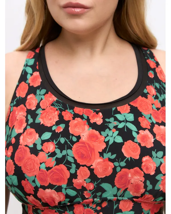 Close-up of the Lida swimsuit neckline in red rose print with black trim