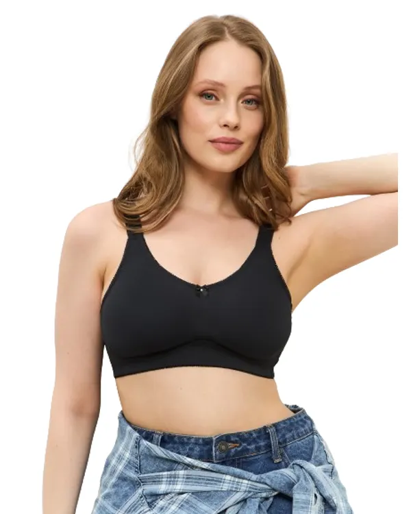 Woman wearing the black everyday mastectomy bra, front view