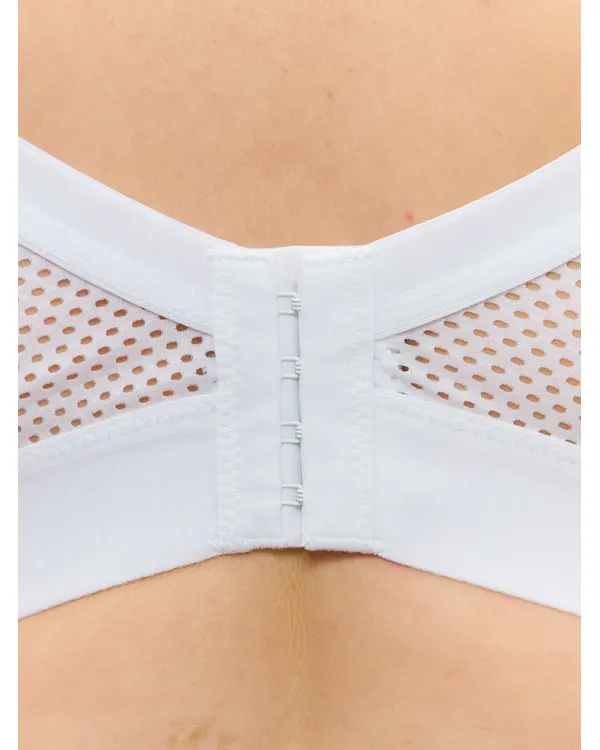 Close-up of the hook-and-eye fastening on the white sport bra